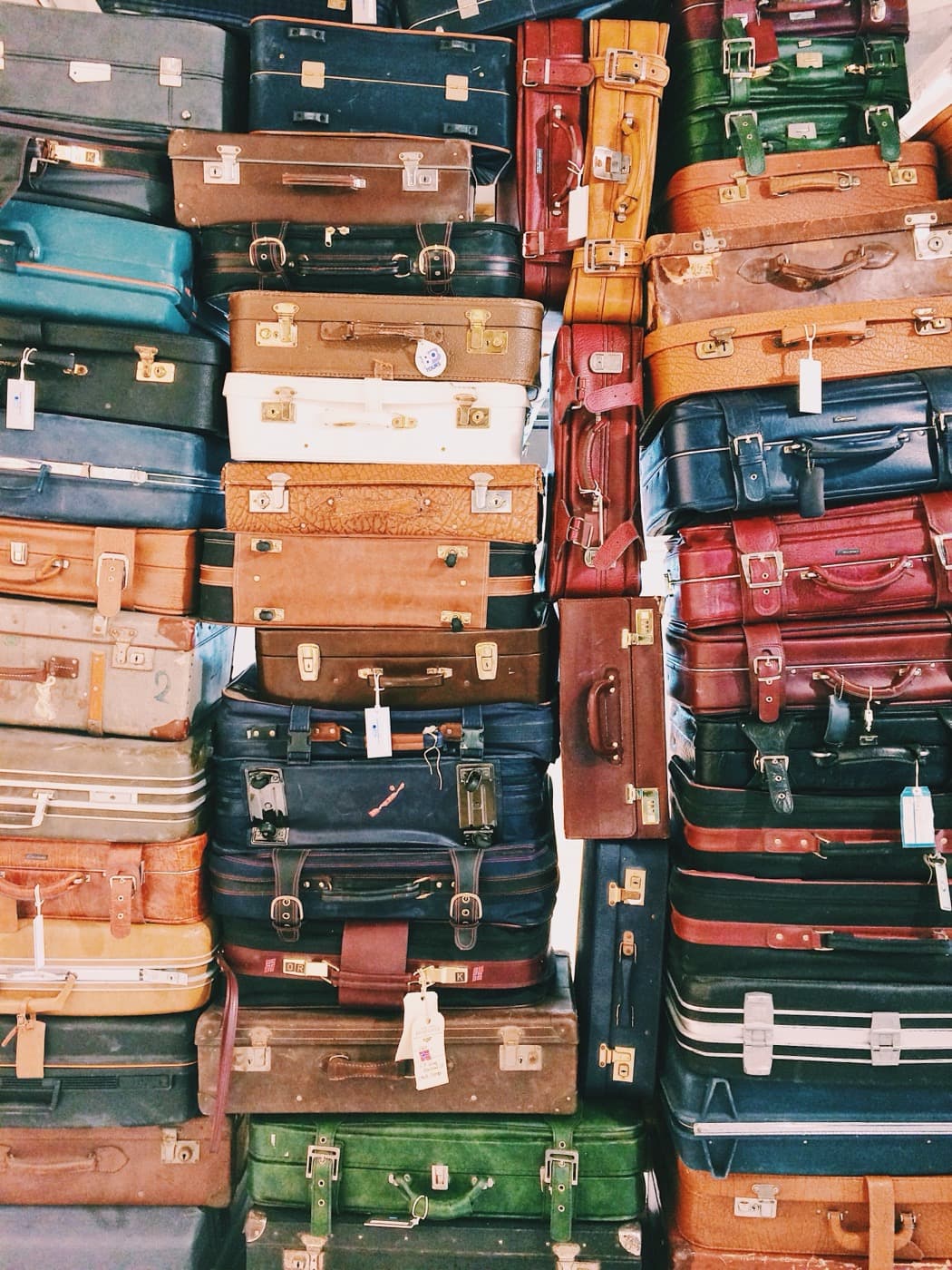 Stack of colorful vintage suitcases